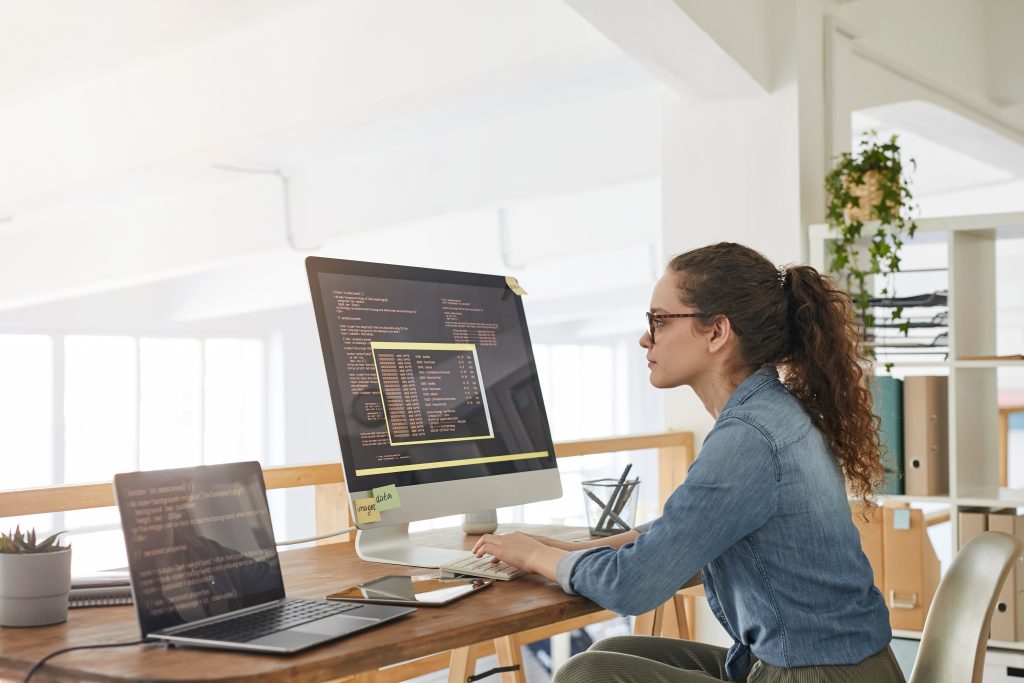 coding career, woman works at table